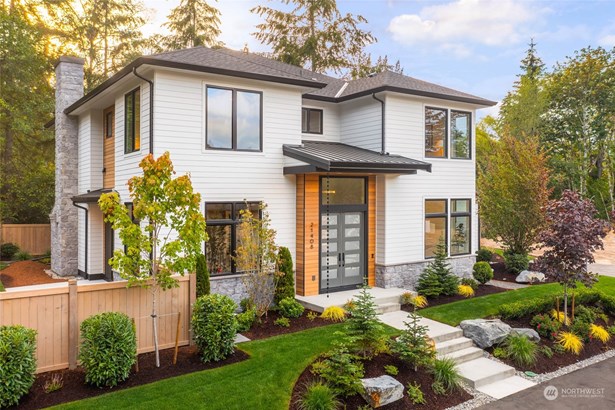 Stained Cedar detail on your covered porch and professional landscape design set the curb appeal