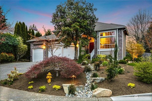 This elegant two story is located on a large private corner lot. The beautiful landscaping is just about to show it&#39;s spring colors and features accent lighting, front sprinklers and a meandering dry stone river.