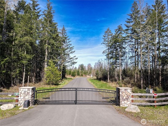 Gated community of West Fork Tracts in Roy, WA. 20 ACRES with Mt Rainier view. Gate maintained by HOA dues $300. per year.