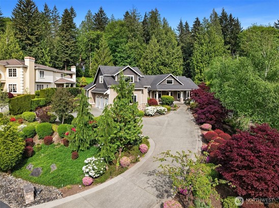 This custom home ,on a shy acre, was meticulously designed and maintained. Positioned on top of the hill and facing west, the home enjoys maximum light exposure throughout the year