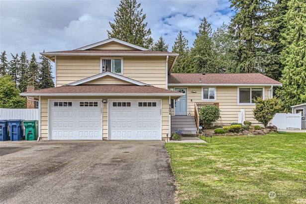 Beautifully Landscaped and new garage doors