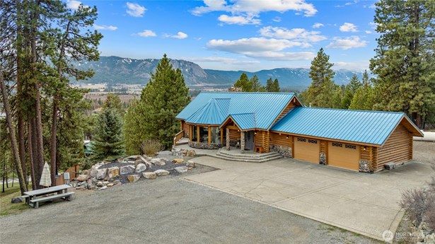 Experience breathtaking views from the timbered interior of this gorgeous log home. combined with breathtaking views.