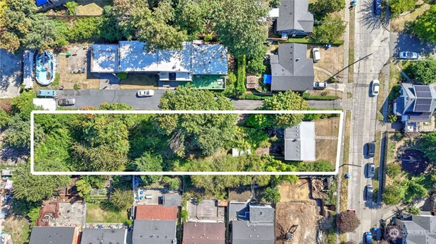 Opportunity awaits investors in Seattle&#39;s Brighton neighborhood! Aerial view of property sitting on .4 of an acre just minutes from Seward Park & Lake WA.