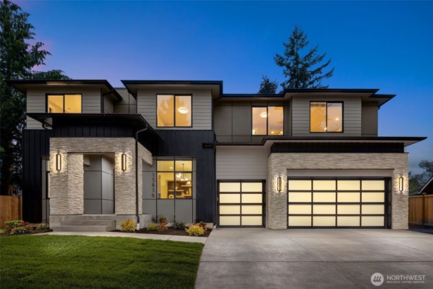 Modern exterior situated on a large, tranquil lot at the end of a cul de sac.