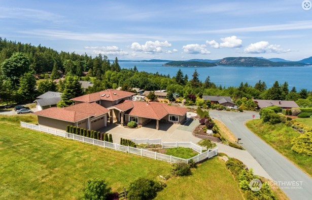 Situated atop this large parcel is privacy and commanding views of the San Juan Islands and glorious sunsets