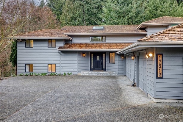 Featuring stunning curb appeal and an expansive driveway.