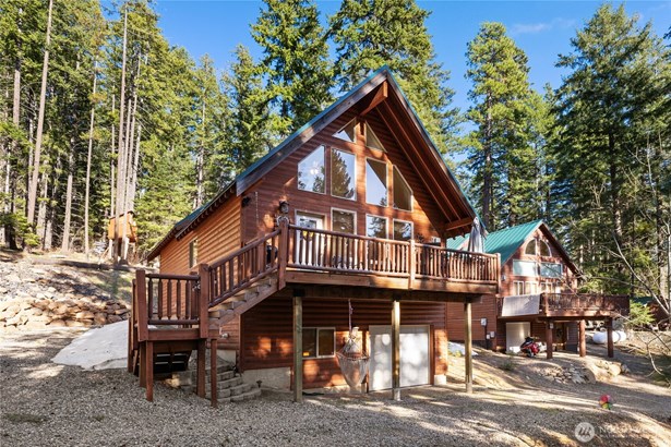 The quintessential cabin, nestled in the trees.