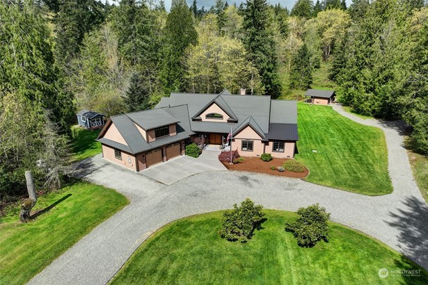 This is an exquisite 3,110 square foot home nestled on 3.33 acres of breathtakingly beautiful property.