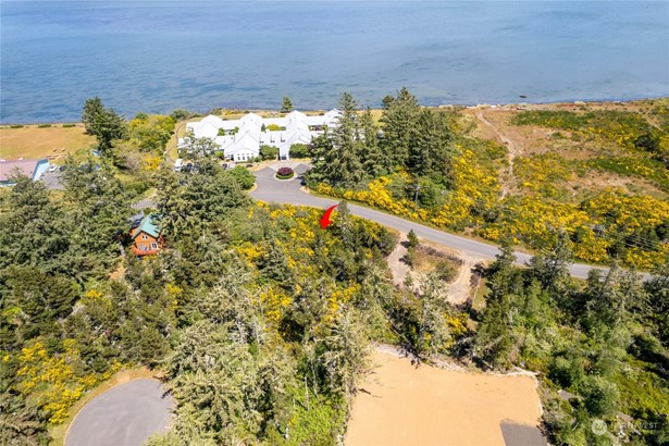 Orange two story two lots down has ocean views from second story. Seller was willing to let us look from his second floor.