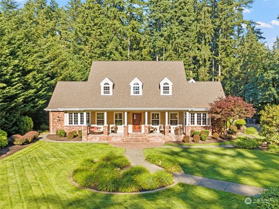 Discover this beautifully custom-built home nestled on 2 private acres.