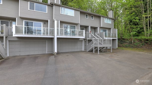 Welcome home to this 2-story condo with private garage in an ever so convenient location situated on Lea Hill.