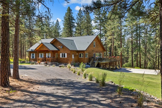 Enjoy mountain living at its finest at this custom home situated on 18+ acres.