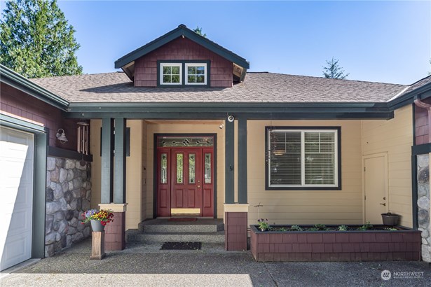 Welcome to this large, comfortable and gracious home. Rear windows look out on the terrain below and views of Ludlow Bay in the distance.