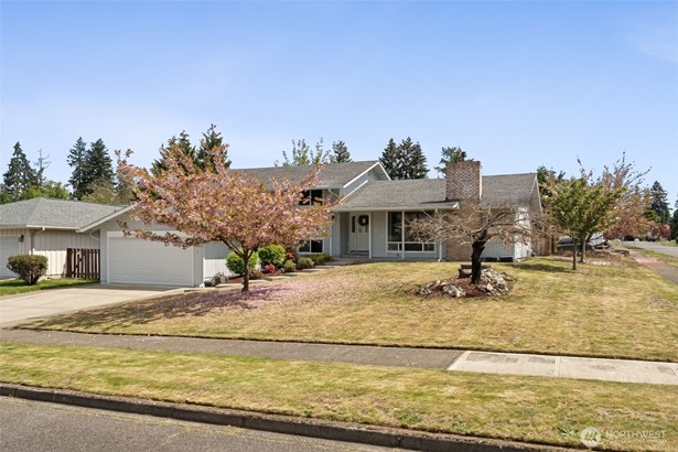 Front of home on big corner lot.