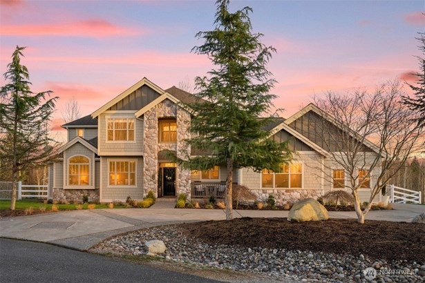 Grand entrance to a circle driveway with stunning curb appeal.