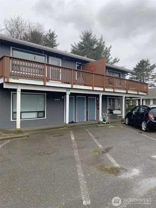 The middle door leads to the unit.  The parking spot is the empty one to the right in this photo.  It&#39;s marked &#39;20&#39;, but it&#39;s hard to read.