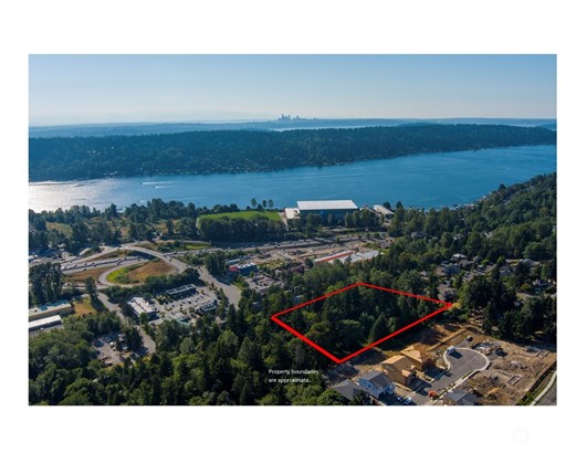 Aerial photo with approximate property boundaries. Seattle in far distance. Seahawks training center and Lake Washington in center. Hazelwood Gardens (sold out - Tri Pointe) under construction in bottom right.