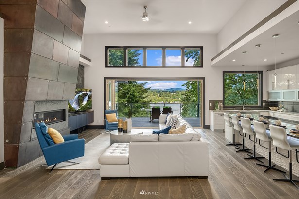 Luxurious and elegant contemporary home with endless Lake Washington views from all three levels. This home features 5 bedrooms, 3 full bathrooms, 2 half bathrooms, and 4,315 sq. ft. of interior space.
