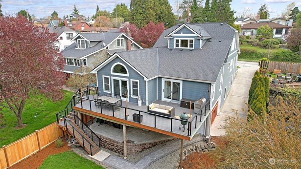 Front of home, parking pad w/EV Charger
