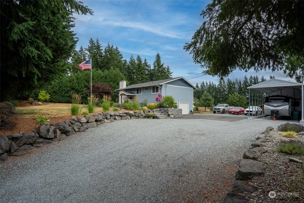 Spacious 2,000 sq. ft., 4 bedroom, 2.5 bath home nestled on over half an acre of professionally landscaped grounds.