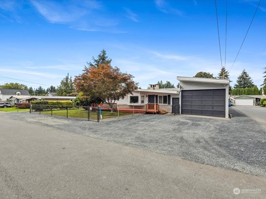 Oversized garage with more parking out front