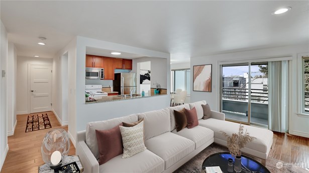 Immerse yourself in this exceptional  condo with private balcony to enjoy Lake Union and city views.
