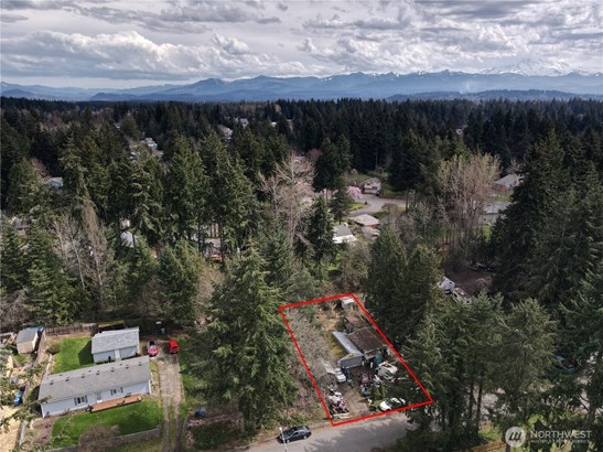 Bonney Lake, WA Rhododendron Park Lot is 8,625 SQ FT. Clean up needed. 1970 garage 600 SQ Ft. single wide mobile home 1963 needs to be removed, also shed on property.