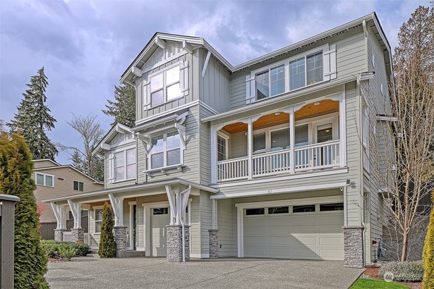 Welcome home! Plenty of parking spaces in front of the 3-car garage.