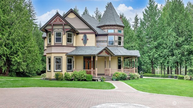 This charming Victorian-style home nestled in a lush, wooded setting offers a perfect blend of historical elegance and modern comfort. With its classic turret, intricate woodwork, and expansive front porch, this residence exudes timeless character.