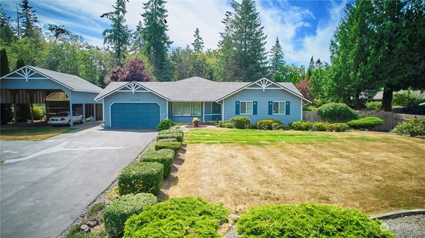 A View of The Front of your Beautiful Property Showing RV Carport! You&#39;ll be close to Seattle Ferries, restaurants, schools, shopping, a golf course and 2 community swimming pools!