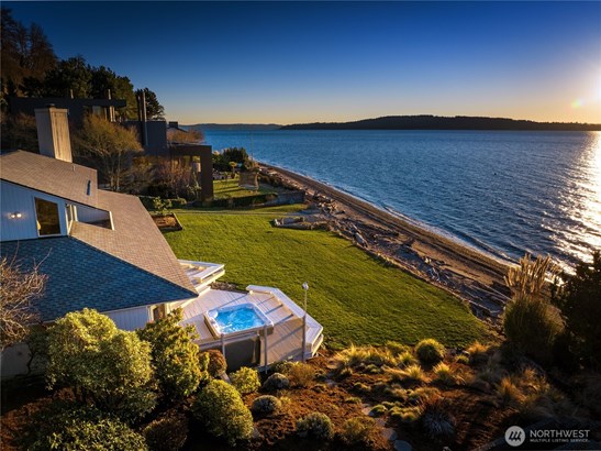 First time ever on the market this custom home was designed by award winning architect A.O. Bumgardner. His vision for this home was meant to be complex yet elegant. Breathtaking water views from the entire house as well as the spacious deck and private hot tub create an oasis of relaxation and entertainment.