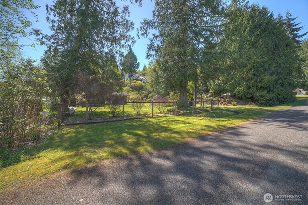 A paved road approaches this beautiful setting.