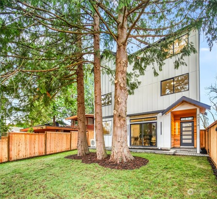 Amazing fenced front yard with gorgeous native Cedar trees