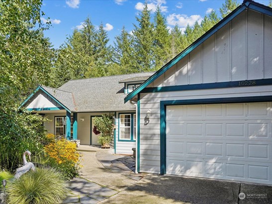 Warm and inviting entry with pond and fountain on the left