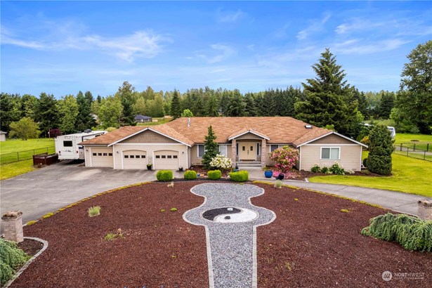 Great rambler with beautiful front yard landscaping. The atmosphere here is serene!