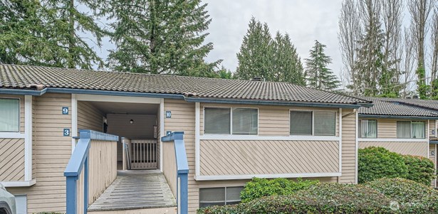 Remodeled end unit with assigned parking space.