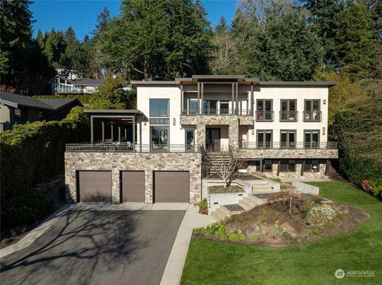 Located on the premier northwest side of the Island, with its prestigious Boulevard Place address, this residence merges refined elegance with contemporary flair. Its striking stucco and true stone façade is just the beginning, with majestic western vistas of the lake, Seward Park, and the Olympic Mountains unfolding before your eyes.