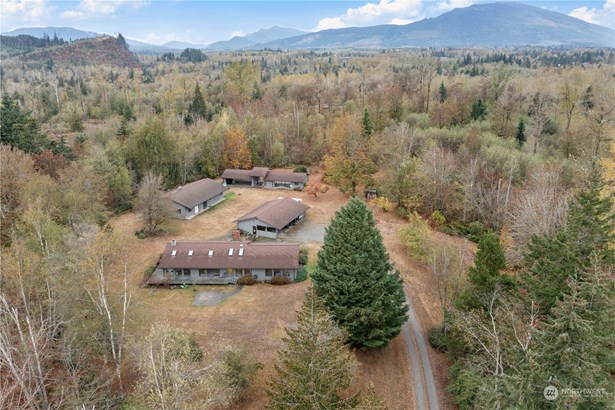 Incredible setting for 2 homes & 2 large outbuildings.