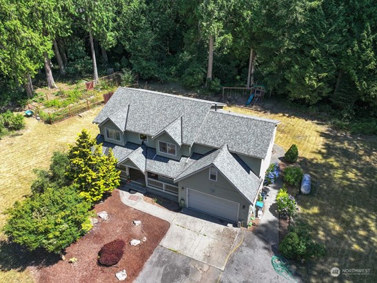 Front of home as seen from above circular portion of driveway