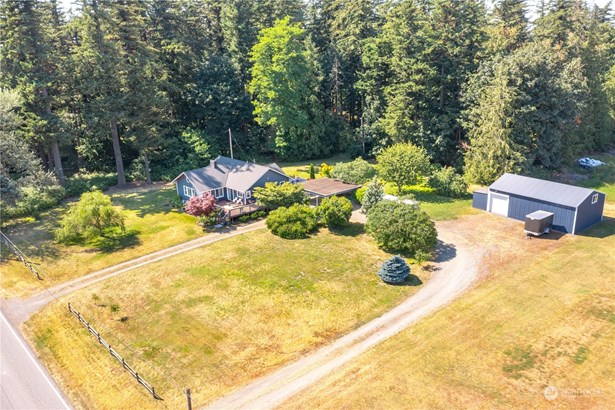 Welcome to this charming 1930&#39;s updated farmhouse on a beautiful flat one acre lot!