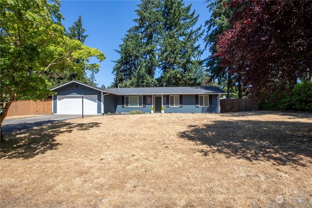 Super cute Rambler with large front yard and 2-car garage.