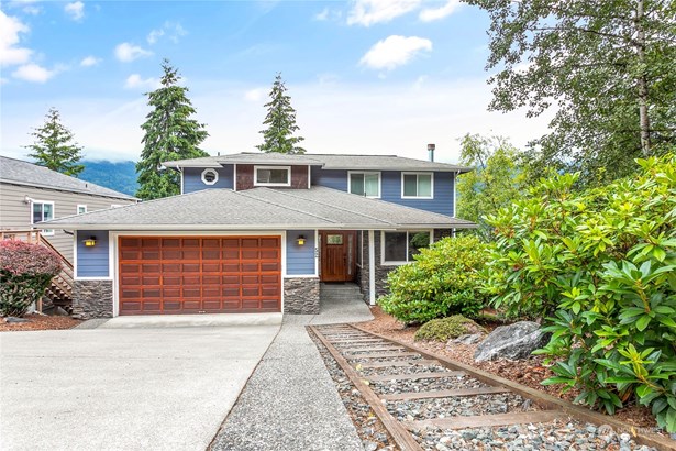 This charming home has wonderful street appeal. Cement siding and stone accent.