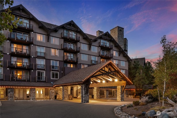 The Lodge at Suncadia under a   beautiful sunset sky.