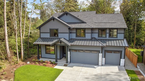 This 3,579 SF home is one of two in a small enclave of custom homes surrounded by tranquil tees and beautiful sunsets.