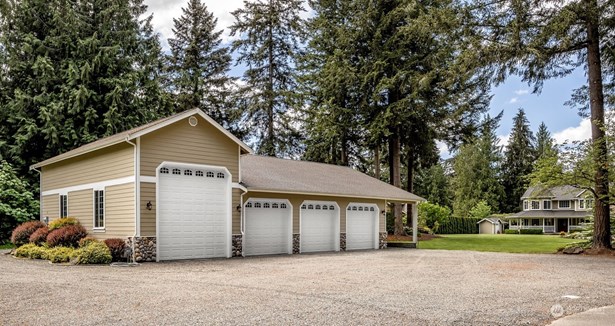 Impressive 73x42 SHOP space! Over 2300 sq  ft of garage parking, office space including 1/2 bath + 504 sq ft of carport!  That&#39;s plenty of room to bring the trailers,  boats & equipment to have a great time!