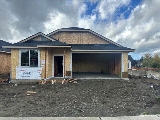 This is a picture of the actual home under construction.  All other pictures are of a different 1800 floor plan. They may have different features, upgrades and colors.