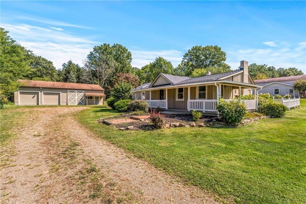 Enjoy a rural setting on 1.55 acres in Sharpsville