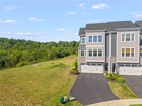 Privacy abounds in this end unit townhouse surroun