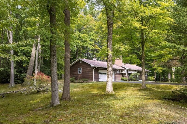 Beautiful home nestled in trees.