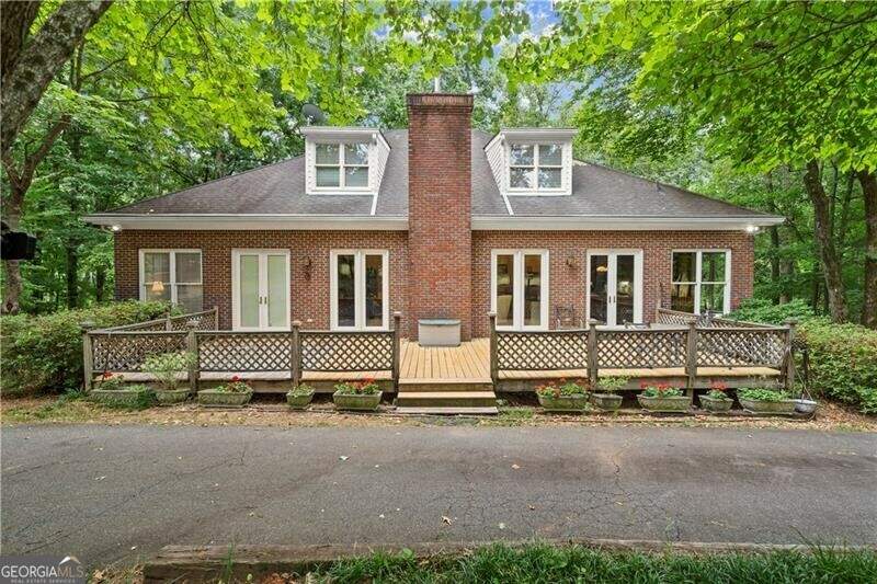 View of  back of property with an oversized deck